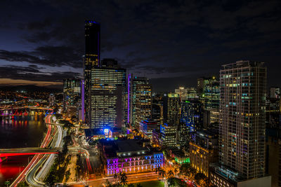 High angle view of illuminated buildings in city at night