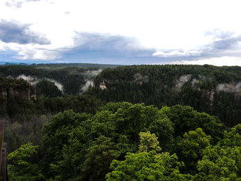 Scenic view of mountain against cloudy sky