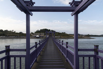 Pier over sea against sky