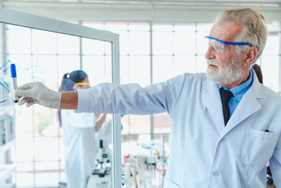 Man standing by window