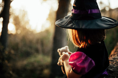 Rear view of woman wearing hat