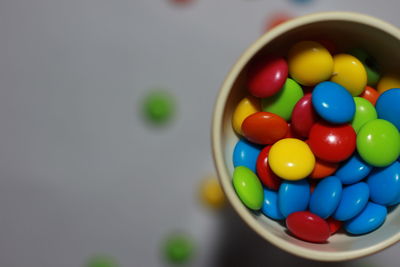 High angle view of multi colored candies on table