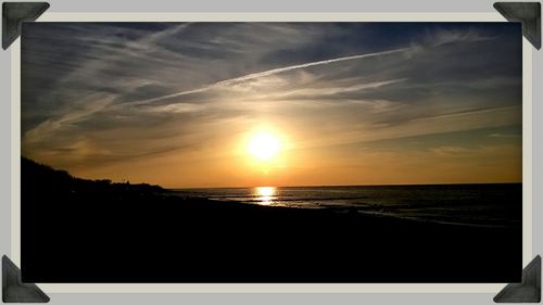 Scenic view of sea at sunset