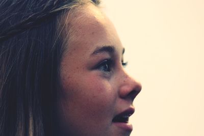 Close-up portrait of a young woman looking away