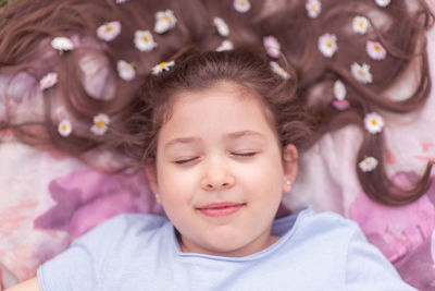 High angle portrait of girl lying down