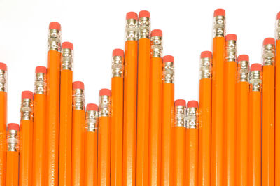 Close-up of multi colored pencils against white background