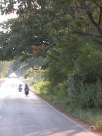 Man riding motorcycle on road