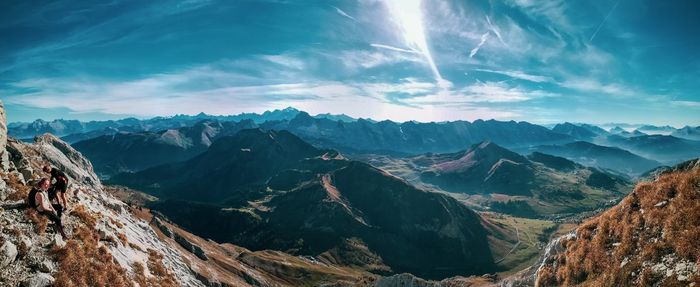 Panoramic view of mountains against cloudy sky