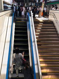 High angle view of people on escalator