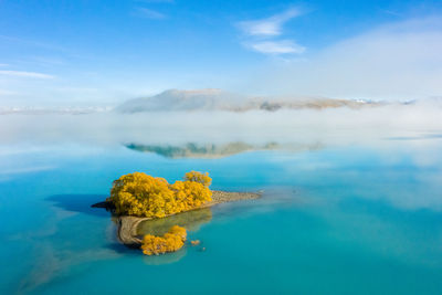 Scenic view of sea against blue sky