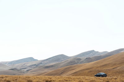 Scenic view of desert against clear sky