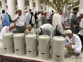 Group of people working at market