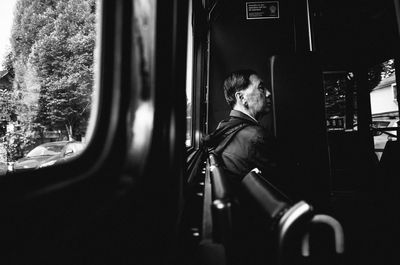 Rear view of man in train