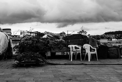 Stack of abandoned harbor against sky in city