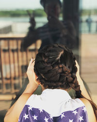 Rear view of woman standing outdoors