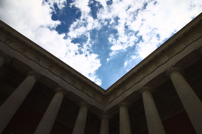 Low angle view of historical building against cloudy sky