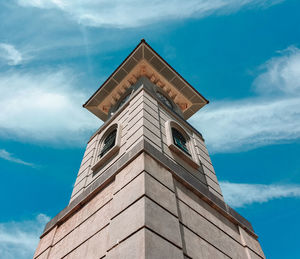 Low angle view of clock tower against sky