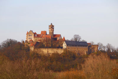 Old building on field against clear sky