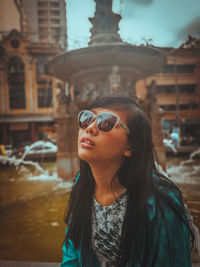 Portrait of young woman wearing sunglasses