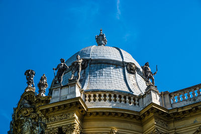 High section of domed structure against blue sky