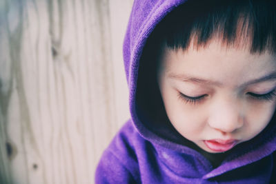 Close-up of boy in hooded shirt