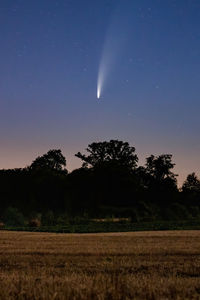 Scenic view of field against sky at night