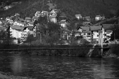 Houses by lake in town