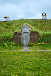 House on field against sky