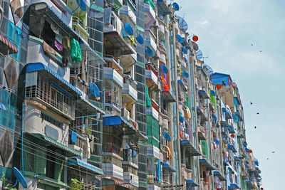 Low angle view of multi colored buildings against sky