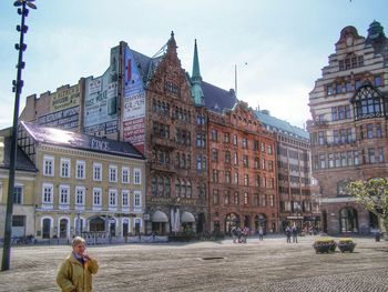 People in front of buildings