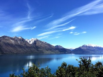 Scenic view of lake next to mountains