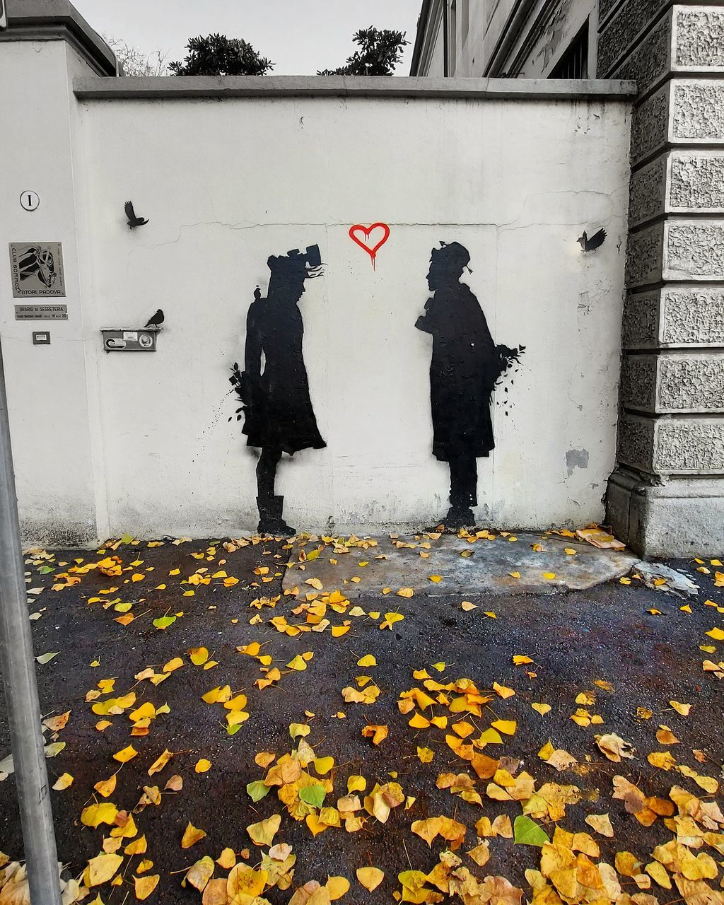 PEOPLE STANDING ON FOOTPATH DURING AUTUMN