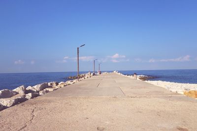 Scenic view of sea against blue sky