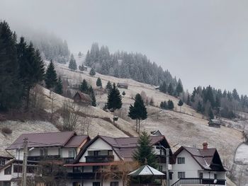 Houses in town against sky