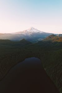 Scenic view of snowcapped mountains against clear sky