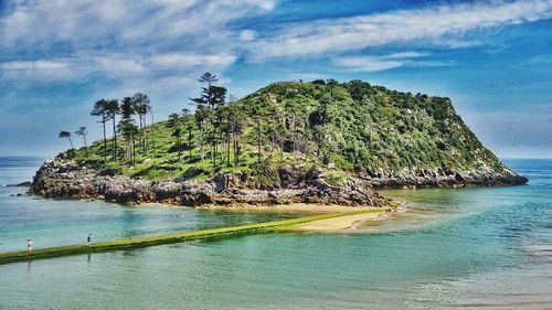Scenic view of sea against cloudy sky