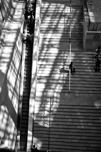 Reflection of man on built structure