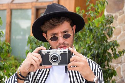 Portrait of man photographing