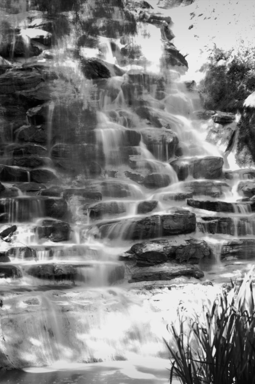 waterfall, water, motion, beauty in nature, scenics - nature, nature, black and white, long exposure, monochrome photography, blurred motion, no people, rock, flowing water, land, water feature, environment, body of water, plant, tree, monochrome, day, tranquility, outdoors, flowing, non-urban scene, idyllic, tranquil scene, sea, forest, watercourse, travel destinations