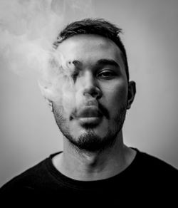 Portrait of young man with a vaping stare 
