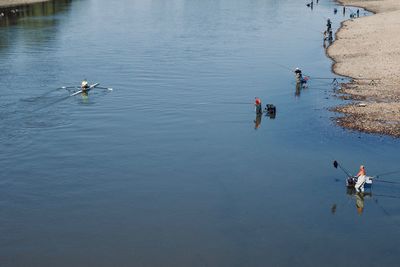 High angle view of people on lake