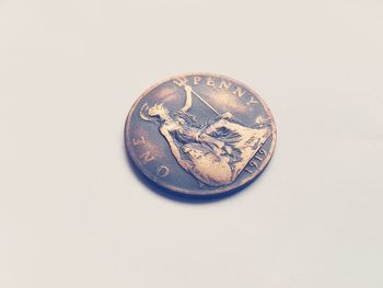 Close-up of coin against white background