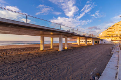 Bridge over sea against sky