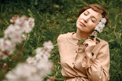 Portrait of a beautiful young woman with eyes closed