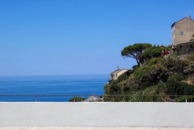 Houses along coast of island