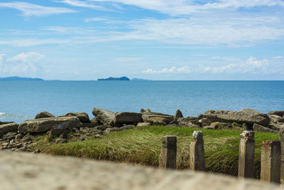 Blue sea under blue skies with white clouds at tanjung aru beach, kota kinabalu, sabah, malaysia.