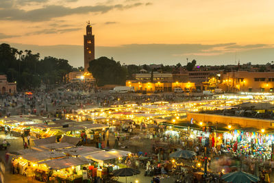 High angle view of illuminated buildings against sky during sunset