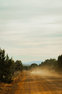 Side by side 4 wheeler driving on forest service road 525 in coconino national forest with red rocks