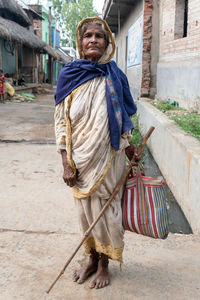 Full length of senior woman on street