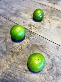 High angle view of green fruits on table